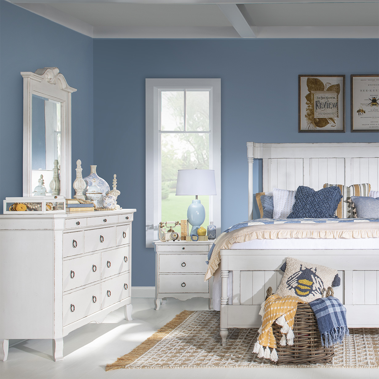 White slat bed with soft blue walls and yellow accents
